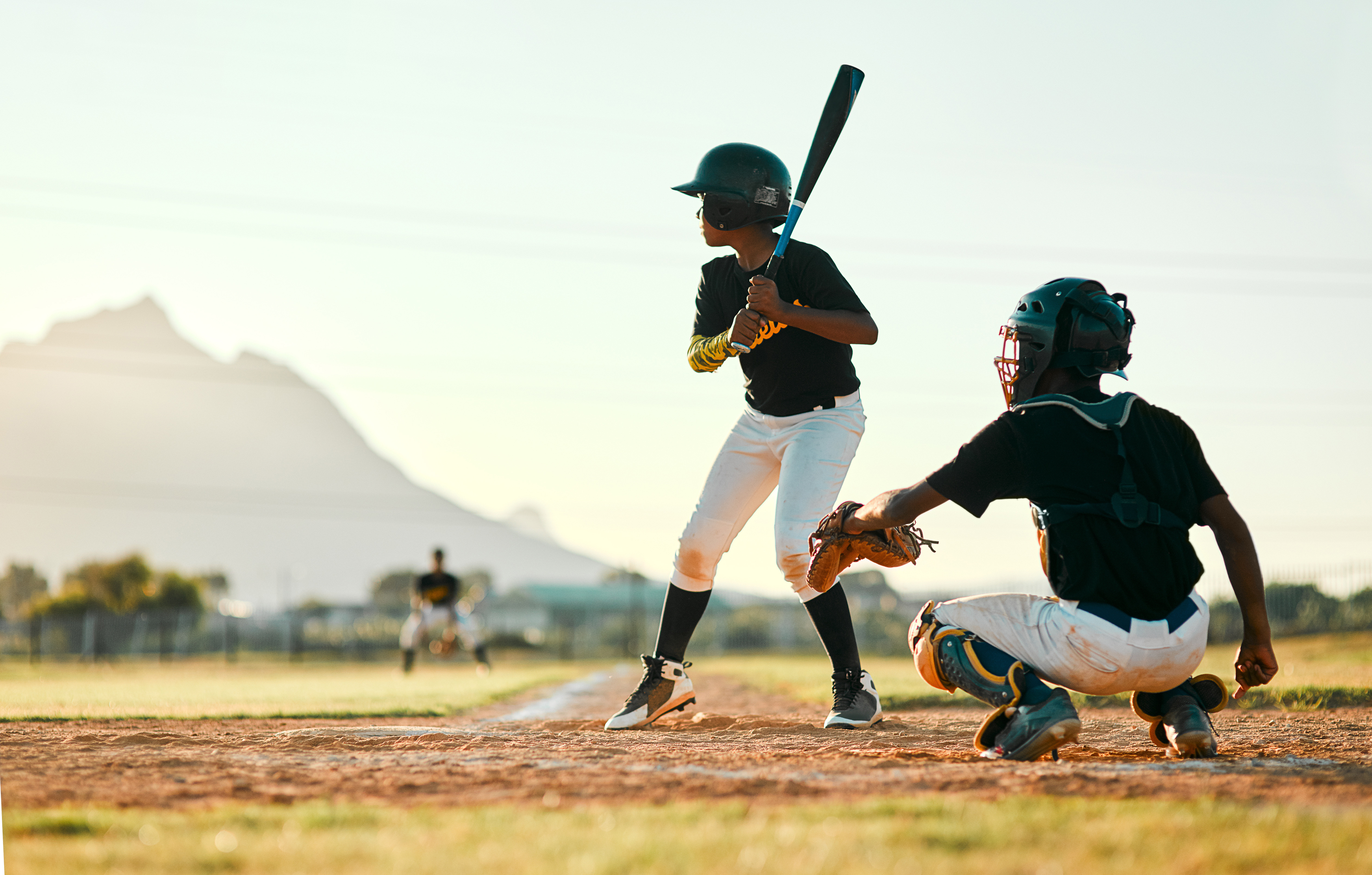 Baseball, sports and players on a field for a game, training and competition. Team challenge, waiting and boys on a pitch for professional sport, practicing and batting in a league for action.