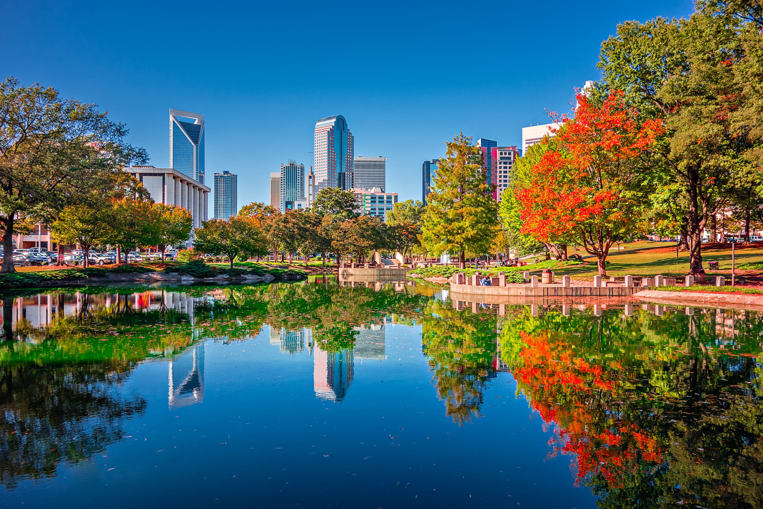 charlotte city skyline from marshall park autumn season with blue sky