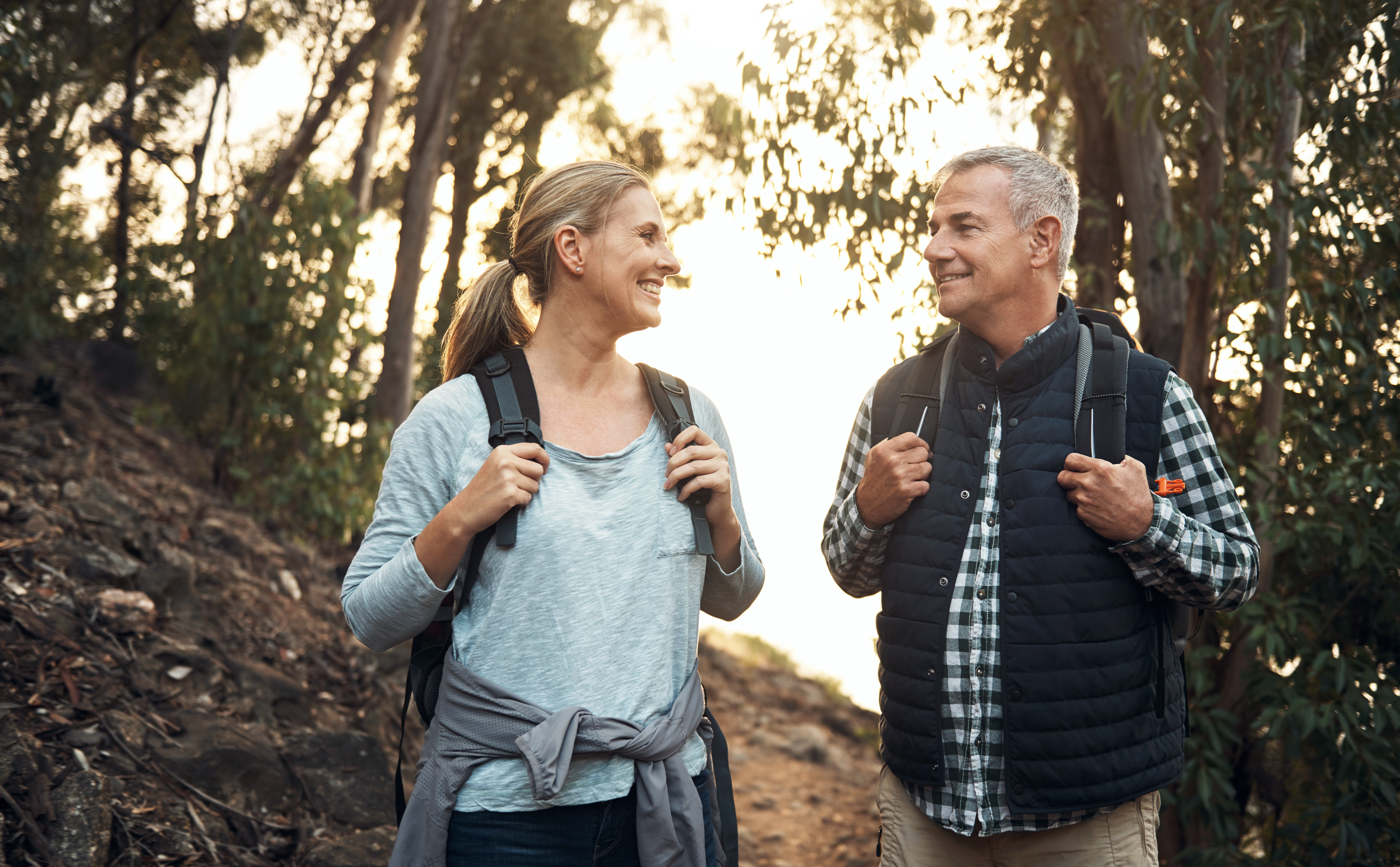 Shot of a mature couple hiking through the mountains