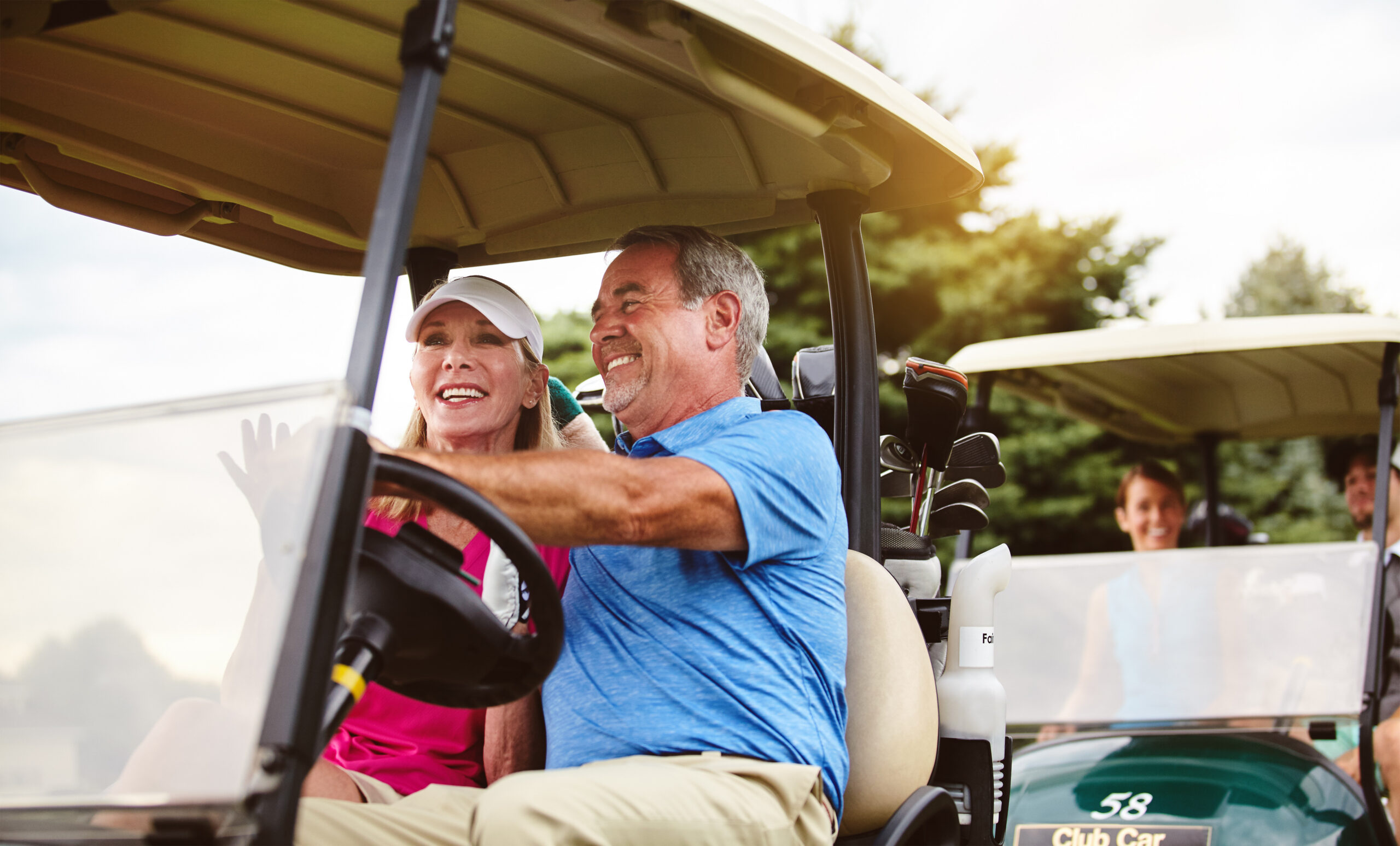 Arriving in style. an affectionate mature couple spending a day on the golf course